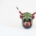Small devil mask with green lizard
