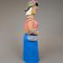 Woman in Green Hat, Pink Top and Blue Skirt